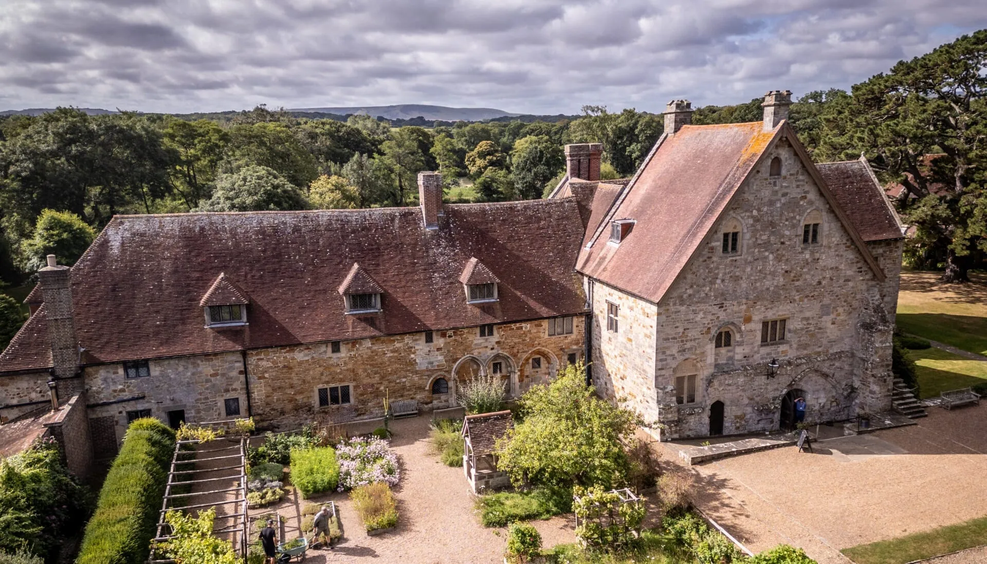 Aerial view of Michelham Priory's Tudor house and gardens